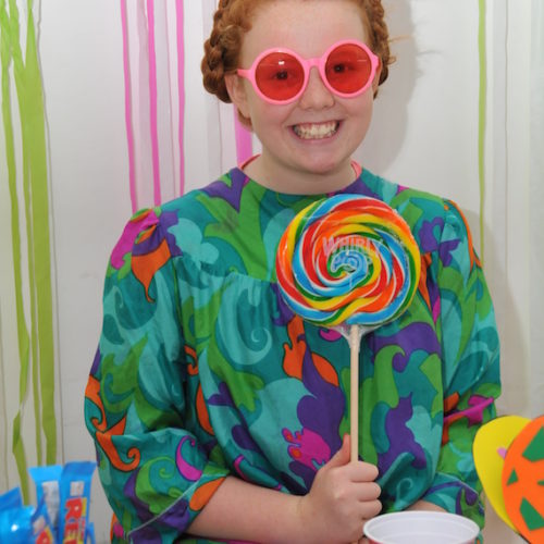 ginger girl holding lollipop